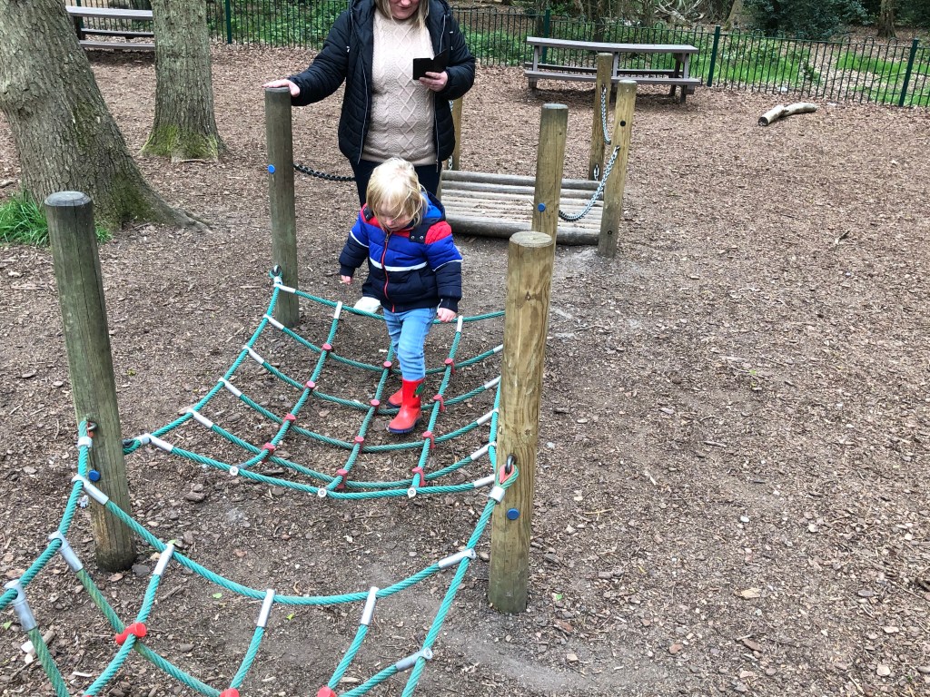 Walking across ropes in the park at High Woods