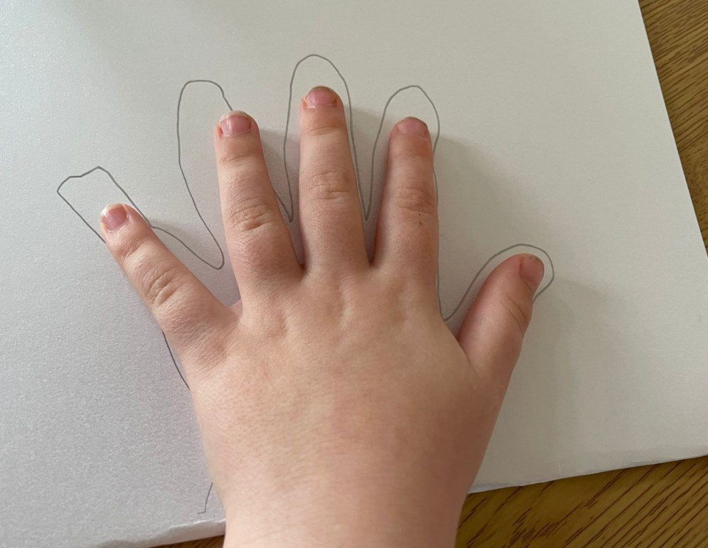 Drawing an outline of my Son’s hand